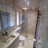 1_Kudos-Frameless-Wet-Room-Shower-Panel-With-Hinged-Return