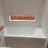 Bath-Area-Recess-With-Tiled-Orange-Mosaics