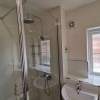 Frameless-Glass-Shower-Screen-With-Flapper-Panel