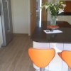 Luxury Handle Less Fitted Kitchen With Solid Worktops