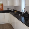 Luxury Handle Less Fitted Kitchen With Solid Worktops