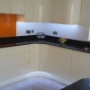 Luxury Handle Less Fitted Kitchen With Solid Worktops