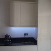 Luxury Handle Less Fitted Kitchen With Solid Worktops