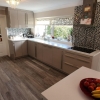 Schuller-Sand-Grey-Gloss-Units-With-MAIA-Cristallo-Solid-Worktops